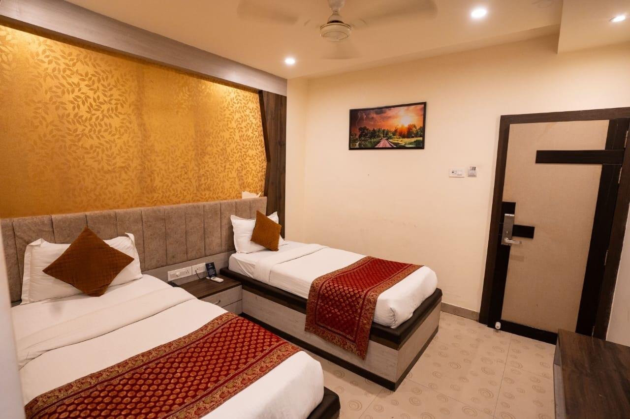 Twin room with two single beds and Banarasi bed runners
